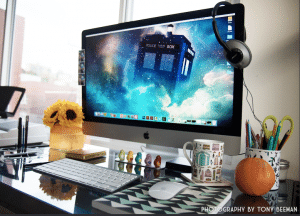 Photograph of computer monitor on desk with tardis dr who background