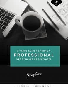 Ebook cover featuring black and white photo of computer, notepad, and coffee cup. Overlaid text "A handy guide to hiring a professional web designer or developer."