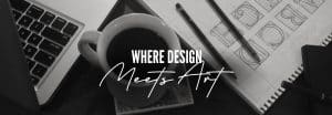 Coffee cup, notebook and pencils in black and white with text "Where Design Meets Art" overlaid